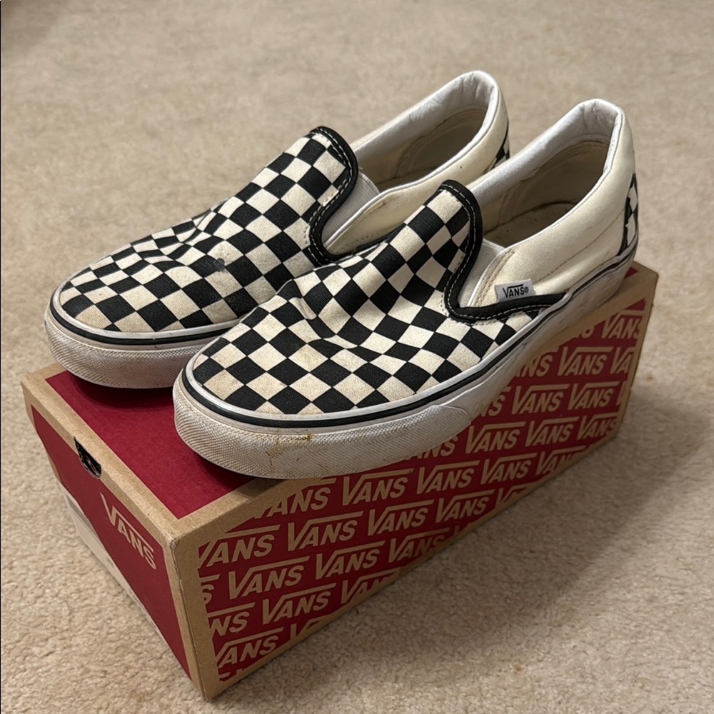 Vans Black and White Sneakers with Classic Slip-On Design